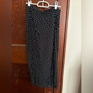 Black and white polka dot skirt. Slit on the side.